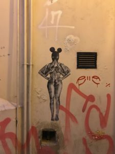 Sticker art, black and white image of a naked woman wearing mickey mouse ears